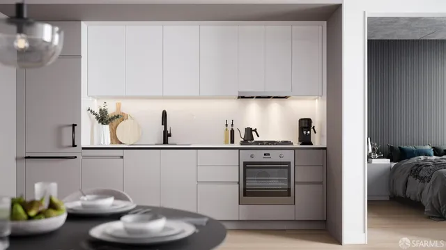 a kitchen with a white stove top oven and cabinets