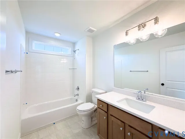 a bathroom with a sink a toilet and a bathtub