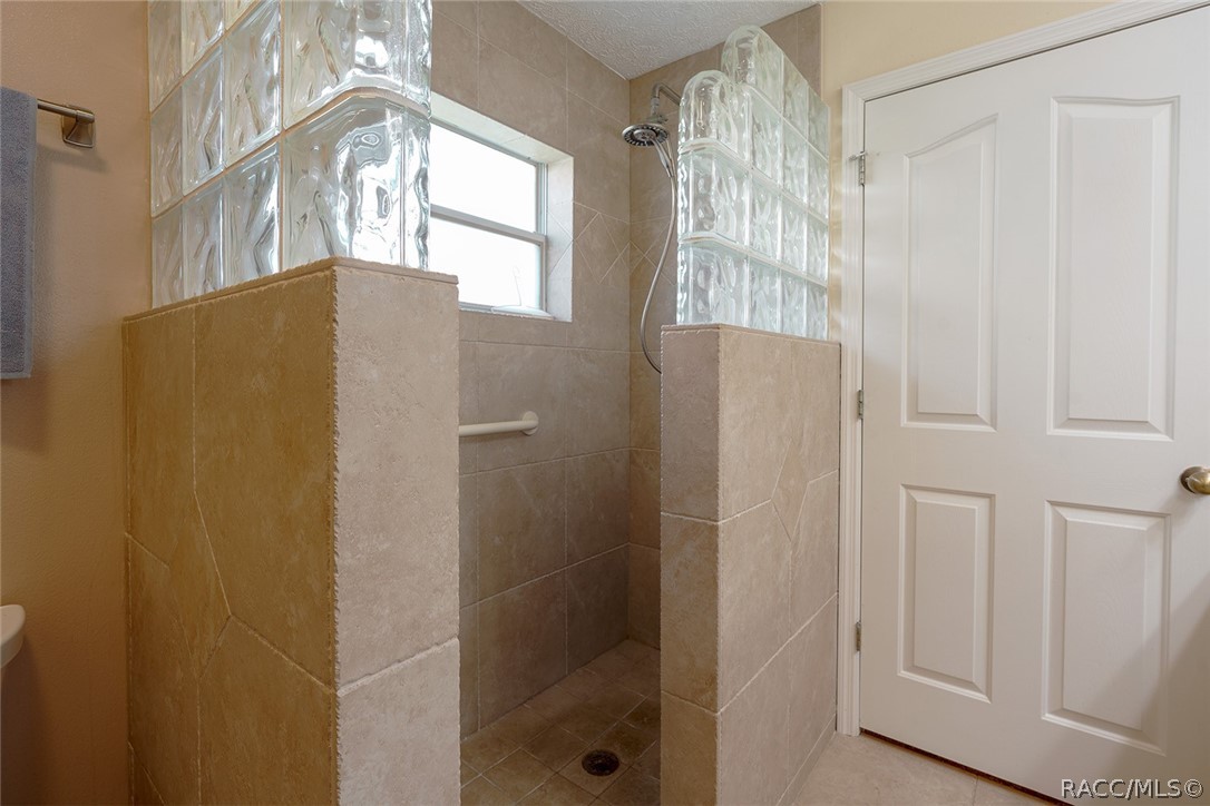 800 Balmoral Court Inverness, FL 34453 - Photo 26 of 72 a bathroom with a shower and a window