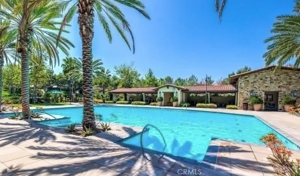 a view of a backyard with plants and a patio