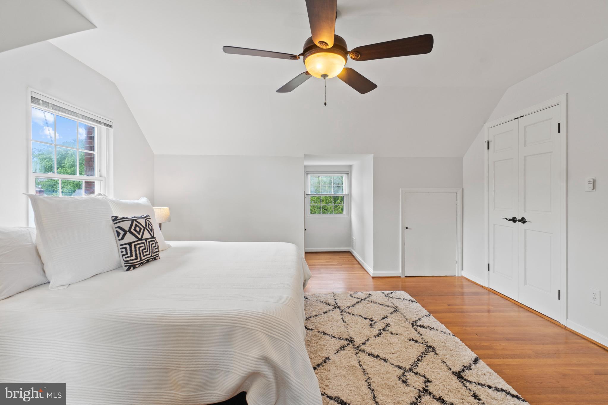 8821 Sundale Drive Silver Spring, MD 20910 - Photo 11 of 27 a bedroom with a large bed and a window