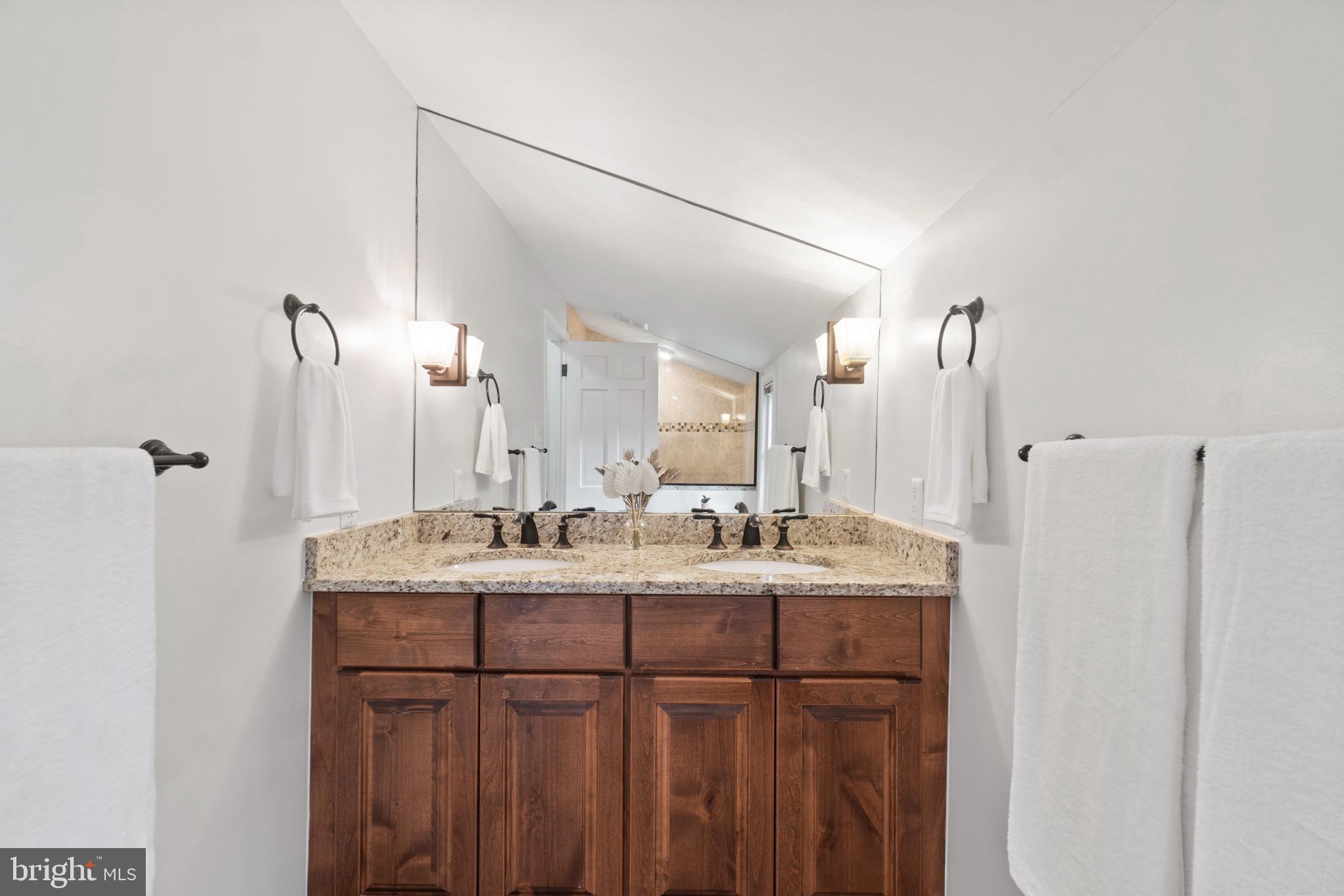 8821 Sundale Drive Silver Spring, MD 20910 - Photo 12 of 27 a bathroom with double sink and a mirror