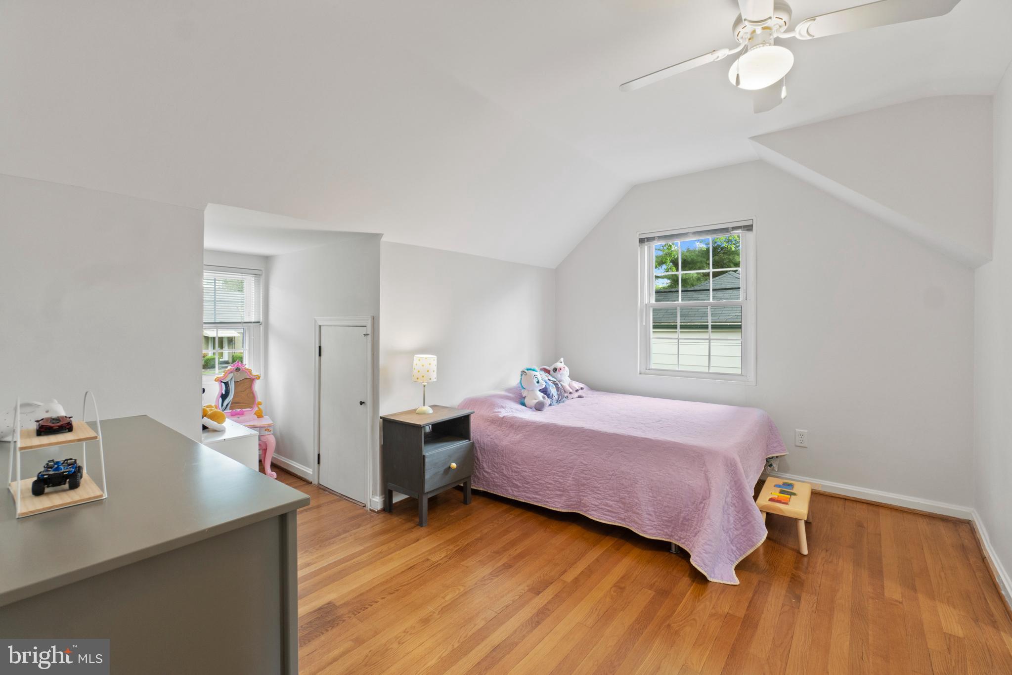 8821 Sundale Drive Silver Spring, MD 20910 - Photo 14 of 27 a bedroom with a bed and wooden floor