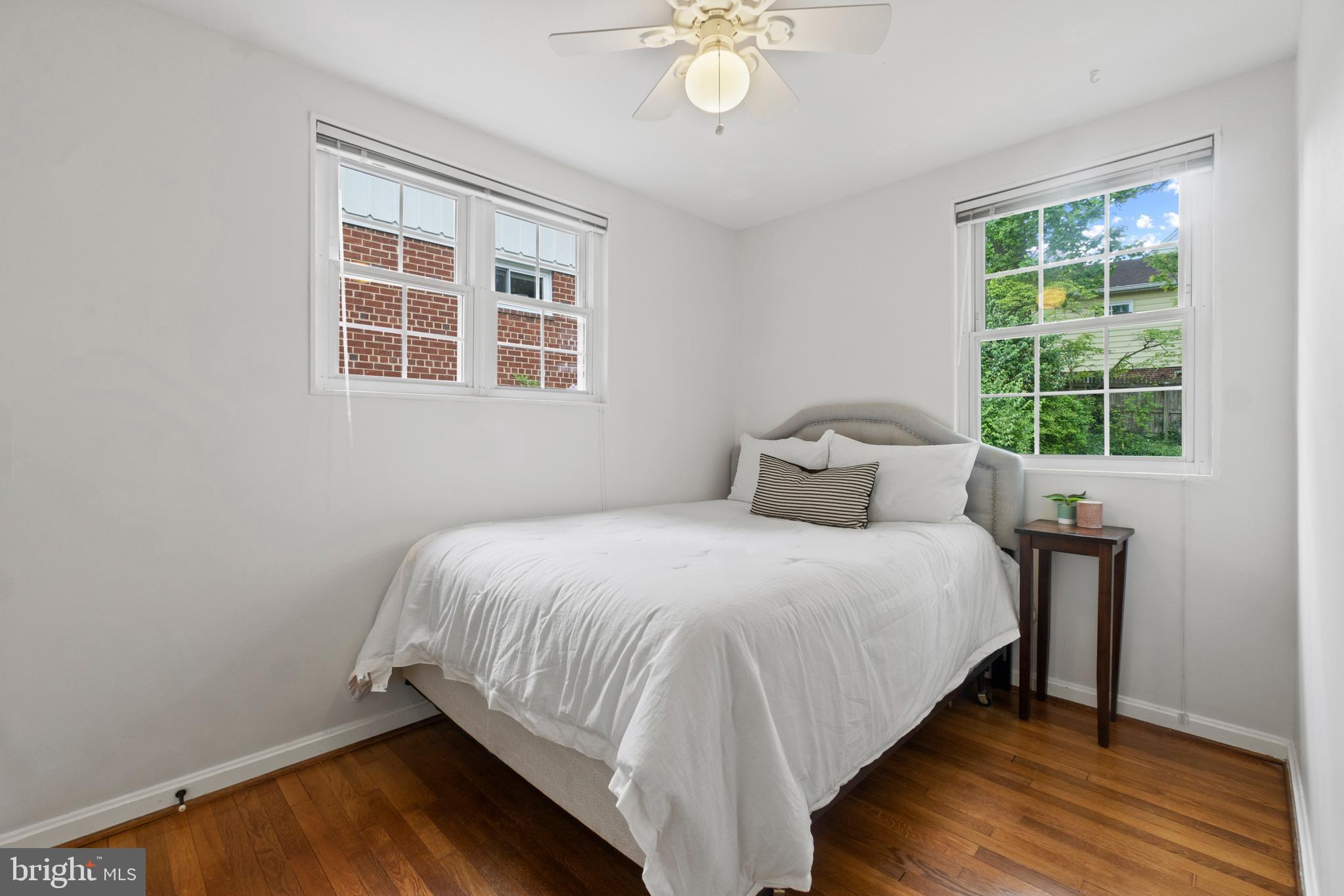 8821 Sundale Drive Silver Spring, MD 20910 - Photo 16 of 27 a bedroom with a bed and window