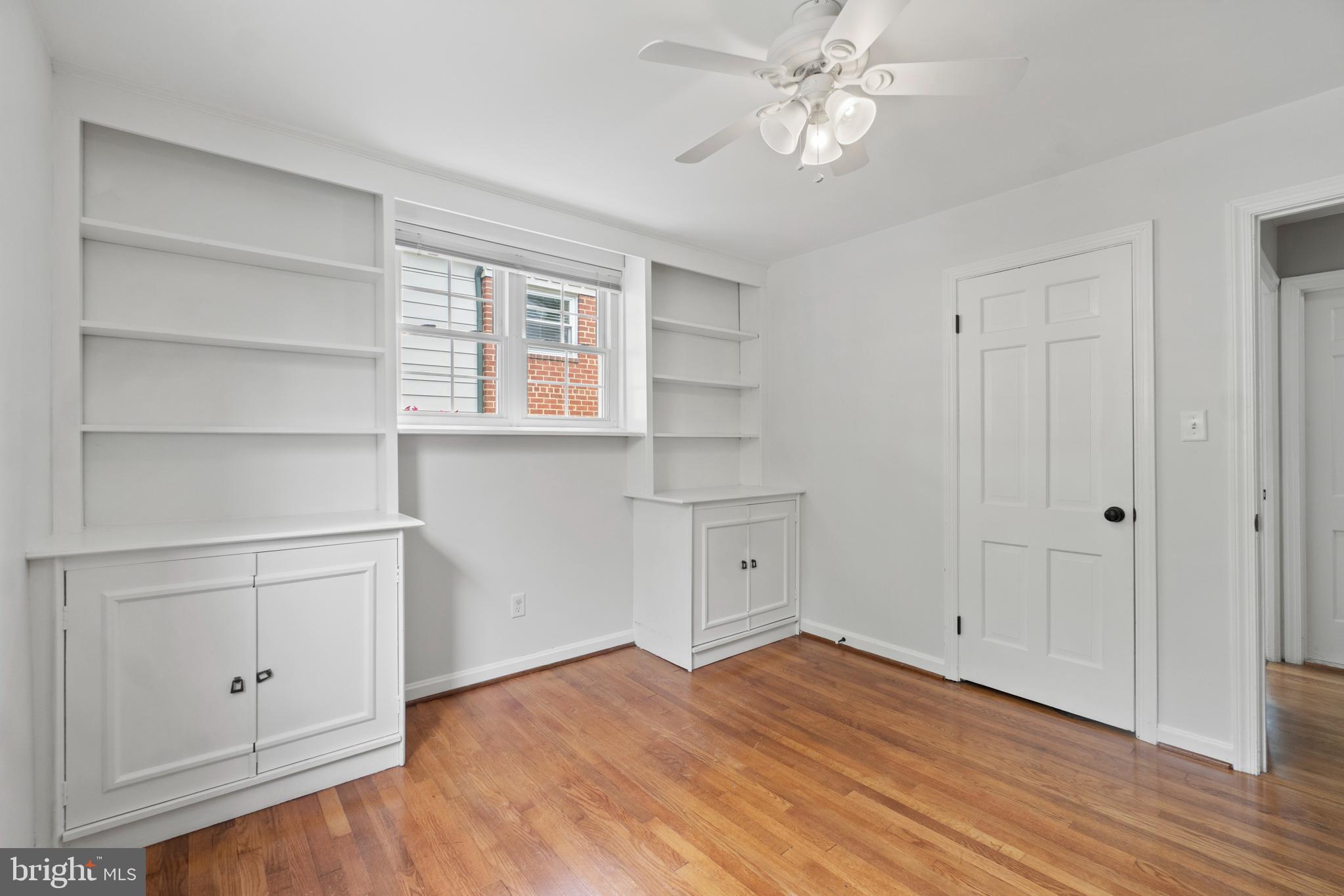 8821 Sundale Drive Silver Spring, MD 20910 - Photo 18 of 27 a view of a room with wooden floor and window