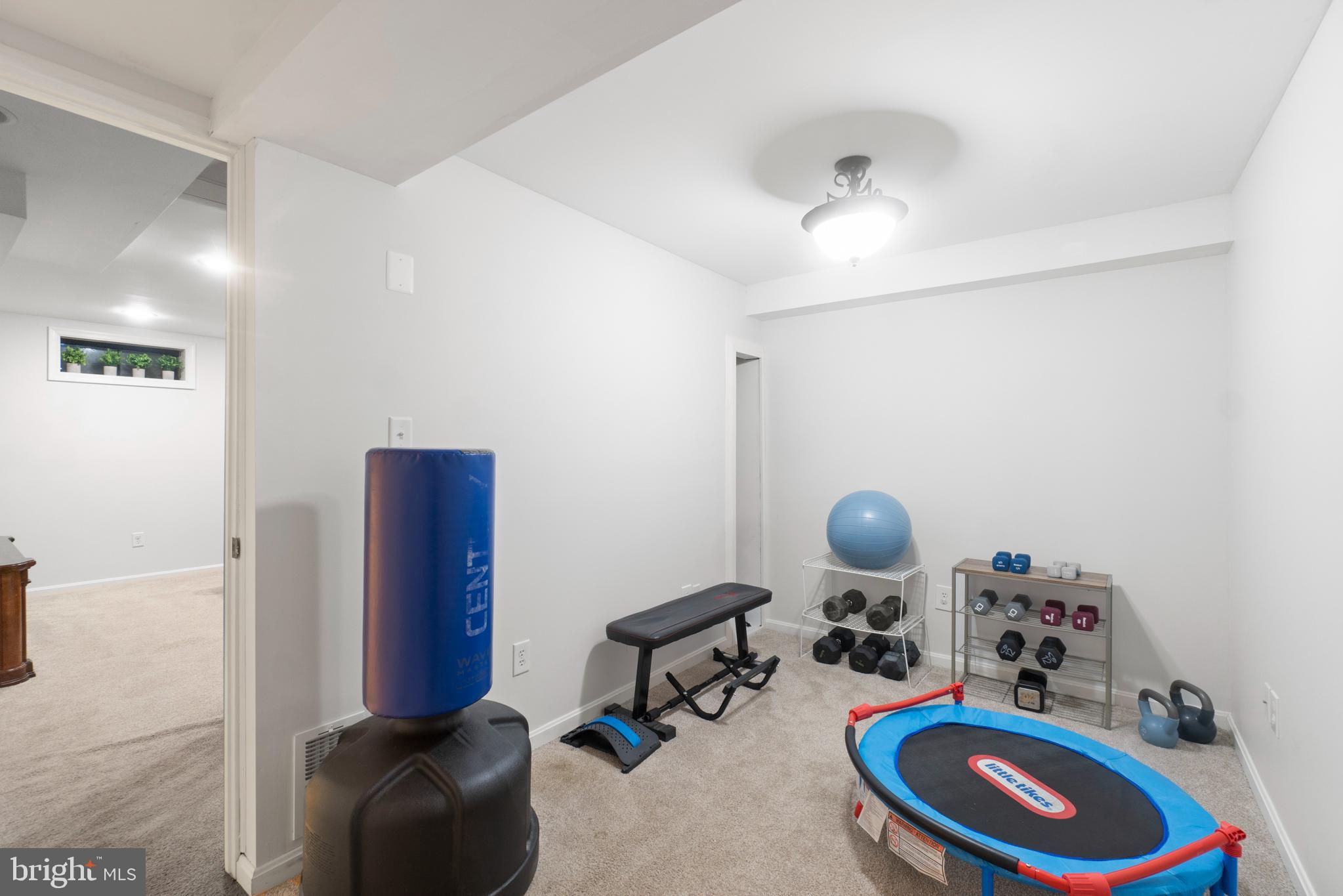 8821 Sundale Drive Silver Spring, MD 20910 - Photo 22 of 27 a room with furniture and gym equipment