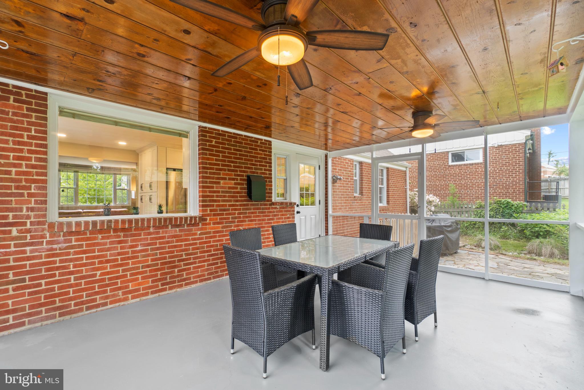 8821 Sundale Drive Silver Spring, MD 20910 - Photo 23 of 27 a view of a dining room with furniture and chandelier