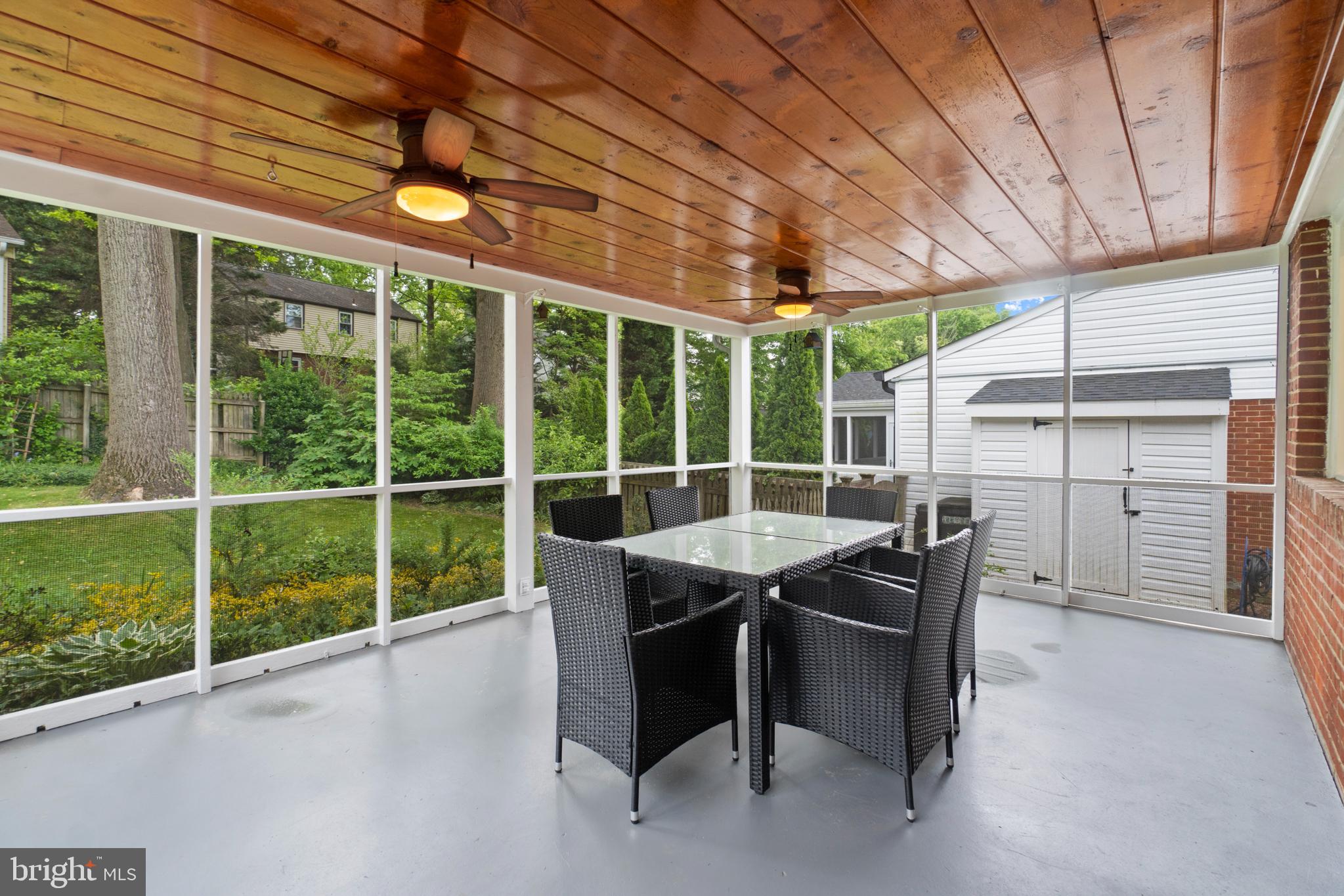 8821 Sundale Drive Silver Spring, MD 20910 - Photo 24 of 27 a view of a patio with a table and chairs