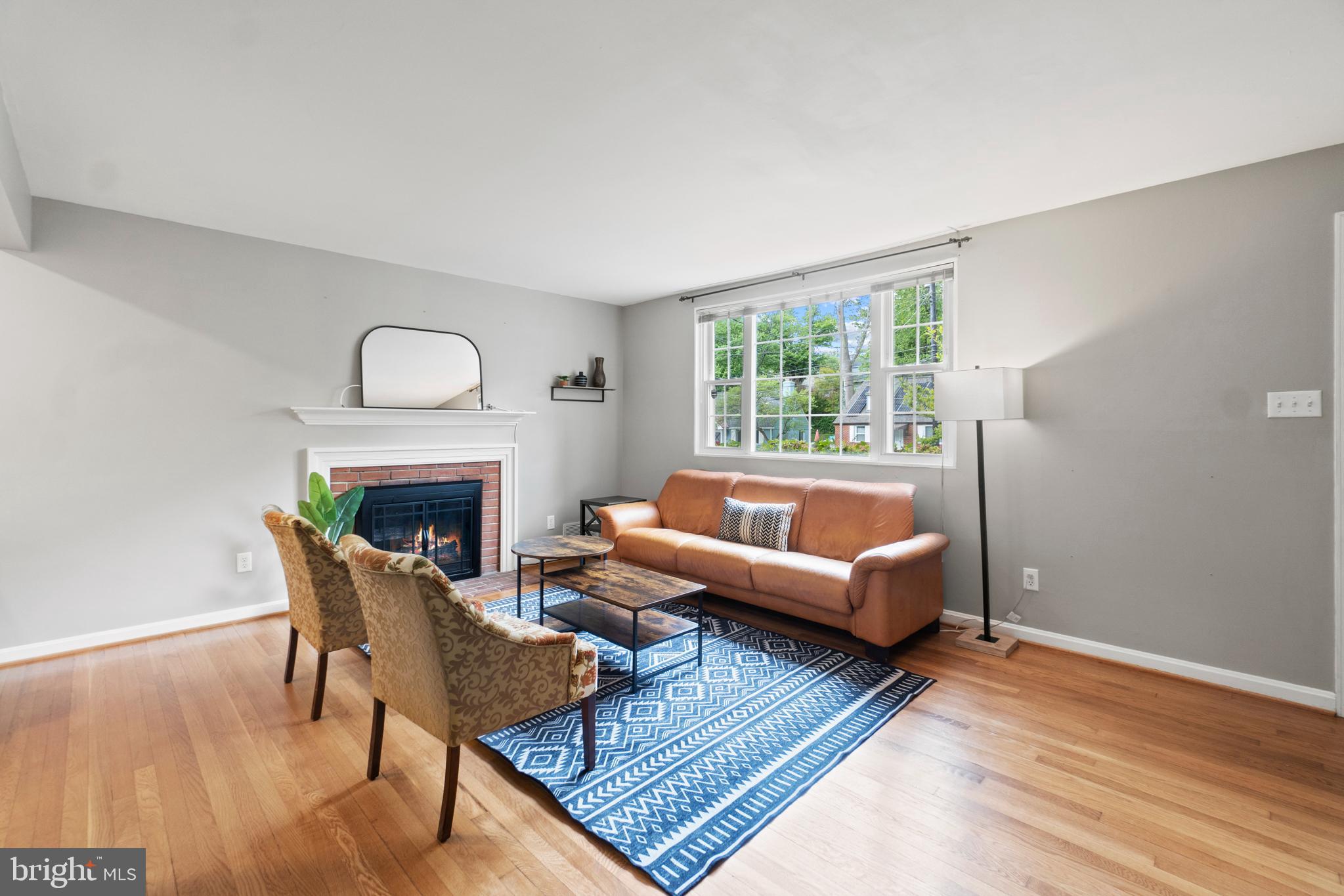 8821 Sundale Drive Silver Spring, MD 20910 - Photo 3 of 27 a living room with furniture and a fireplace