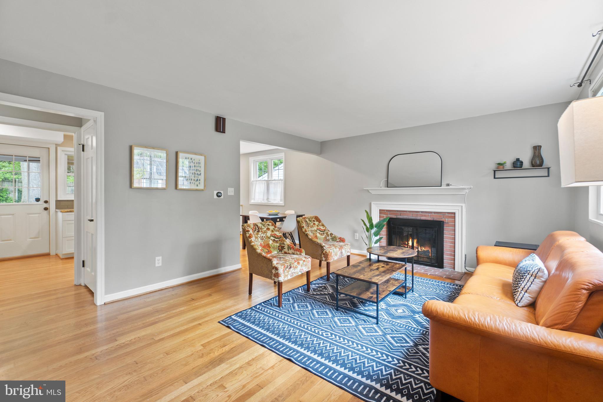 8821 Sundale Drive Silver Spring, MD 20910 - Photo 4 of 27 a living room with furniture and a fireplace