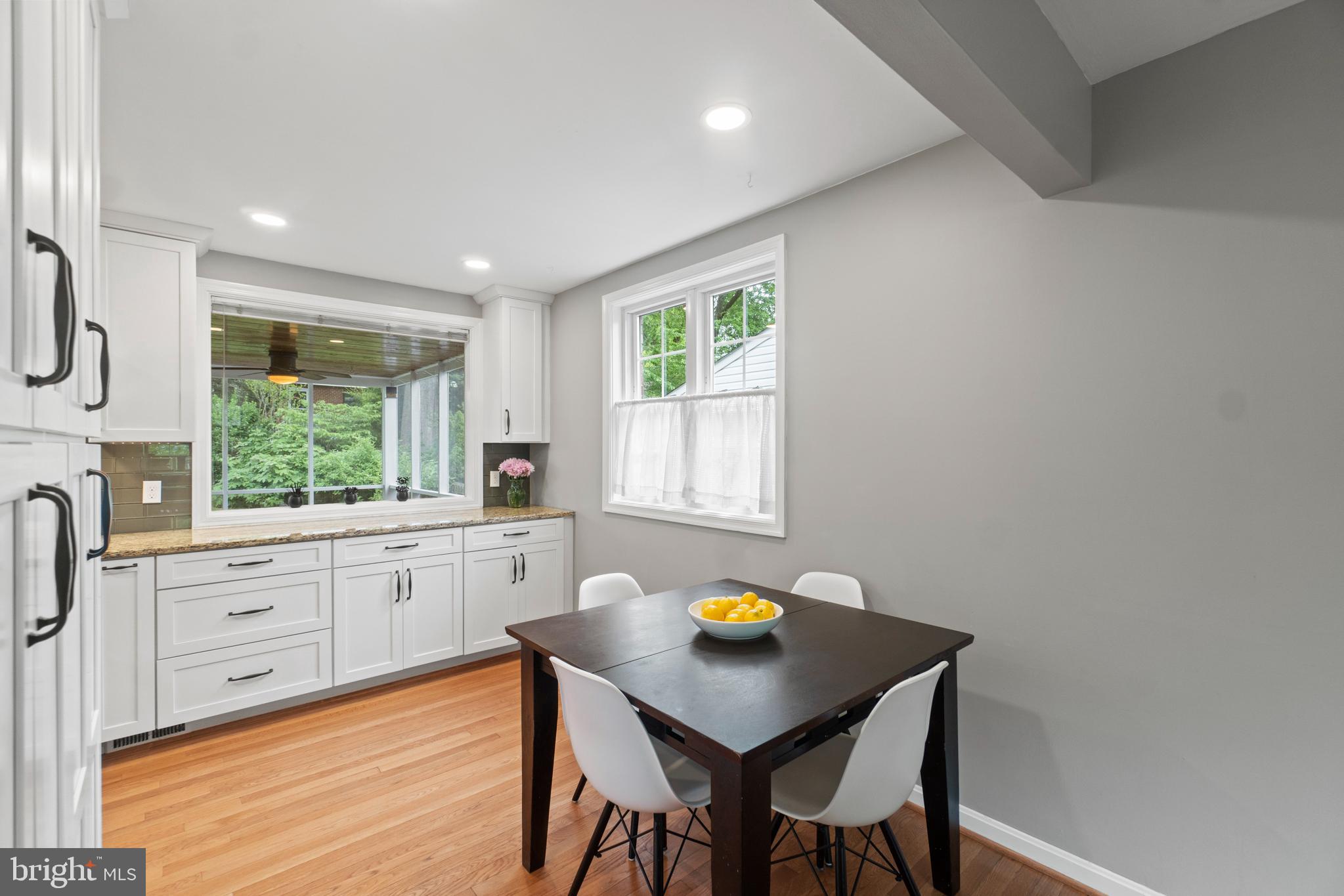 8821 Sundale Drive Silver Spring, MD 20910 - Photo 5 of 27 a kitchen with a table chairs sink and window