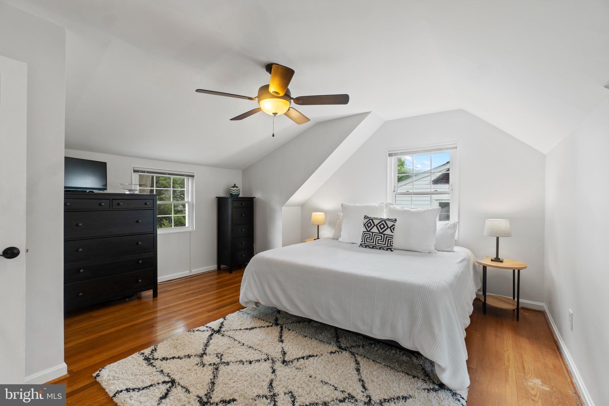 8821 Sundale Drive Silver Spring, MD 20910 - Photo 10 of 27 a bedroom with a bed and a chandelier