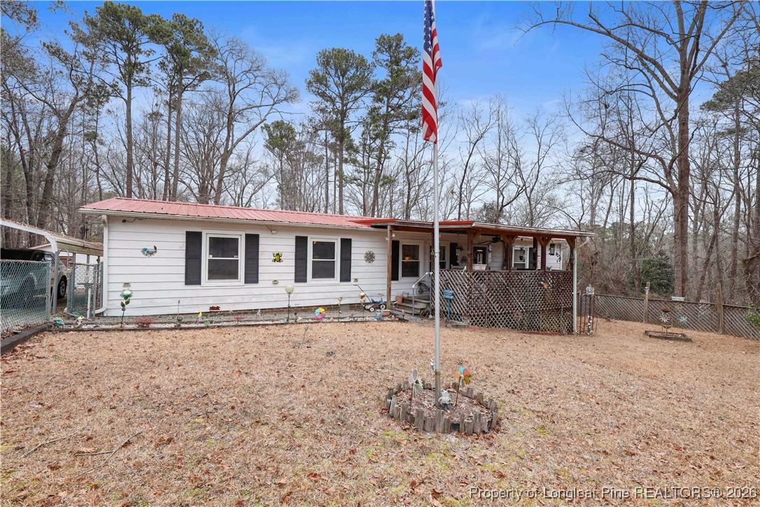 156 Connell Road Carthage, NC 28327 - Photo 35 of 43 a front view of a house with a yard covered in snow