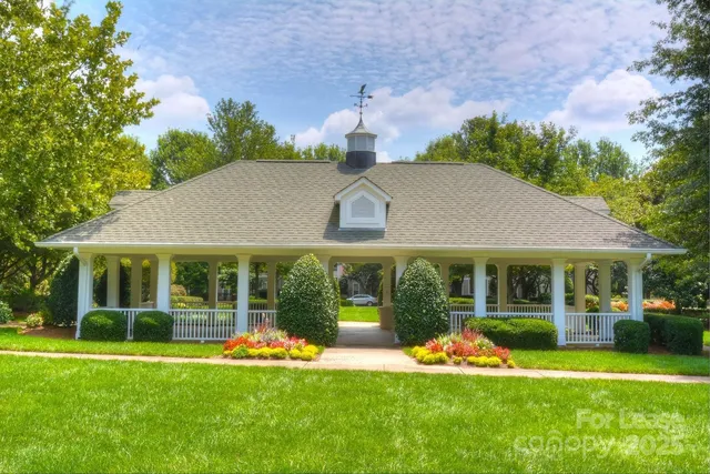 a wooden bench sitting in a yard