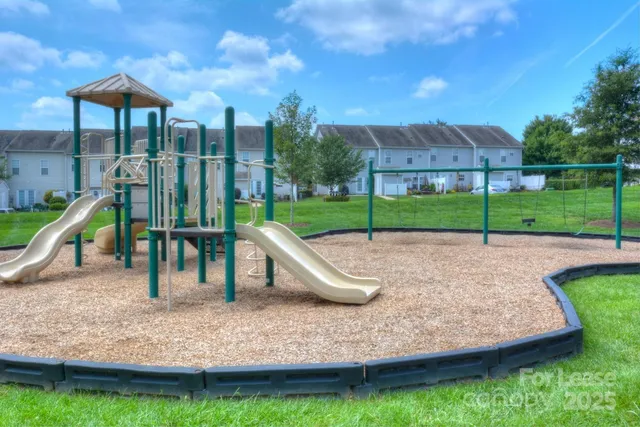 a front view of a house with a yard table and chairs