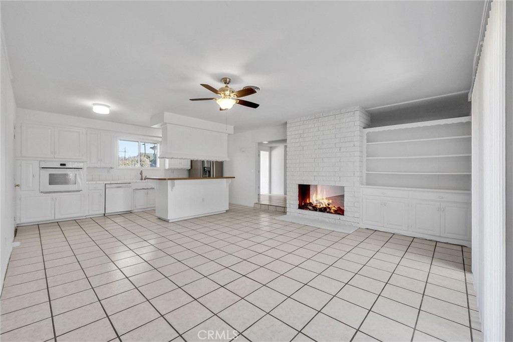 13981 Brenan Way Santa Ana, CA 92705 - Photo 3 of 15 Dining room with hutch and dual fireplace