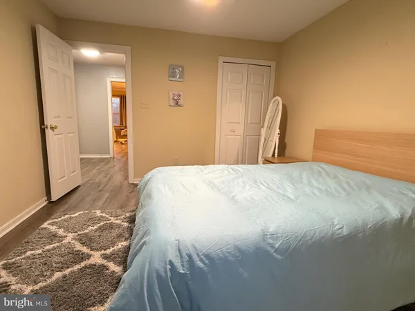 a large white bed in a white room