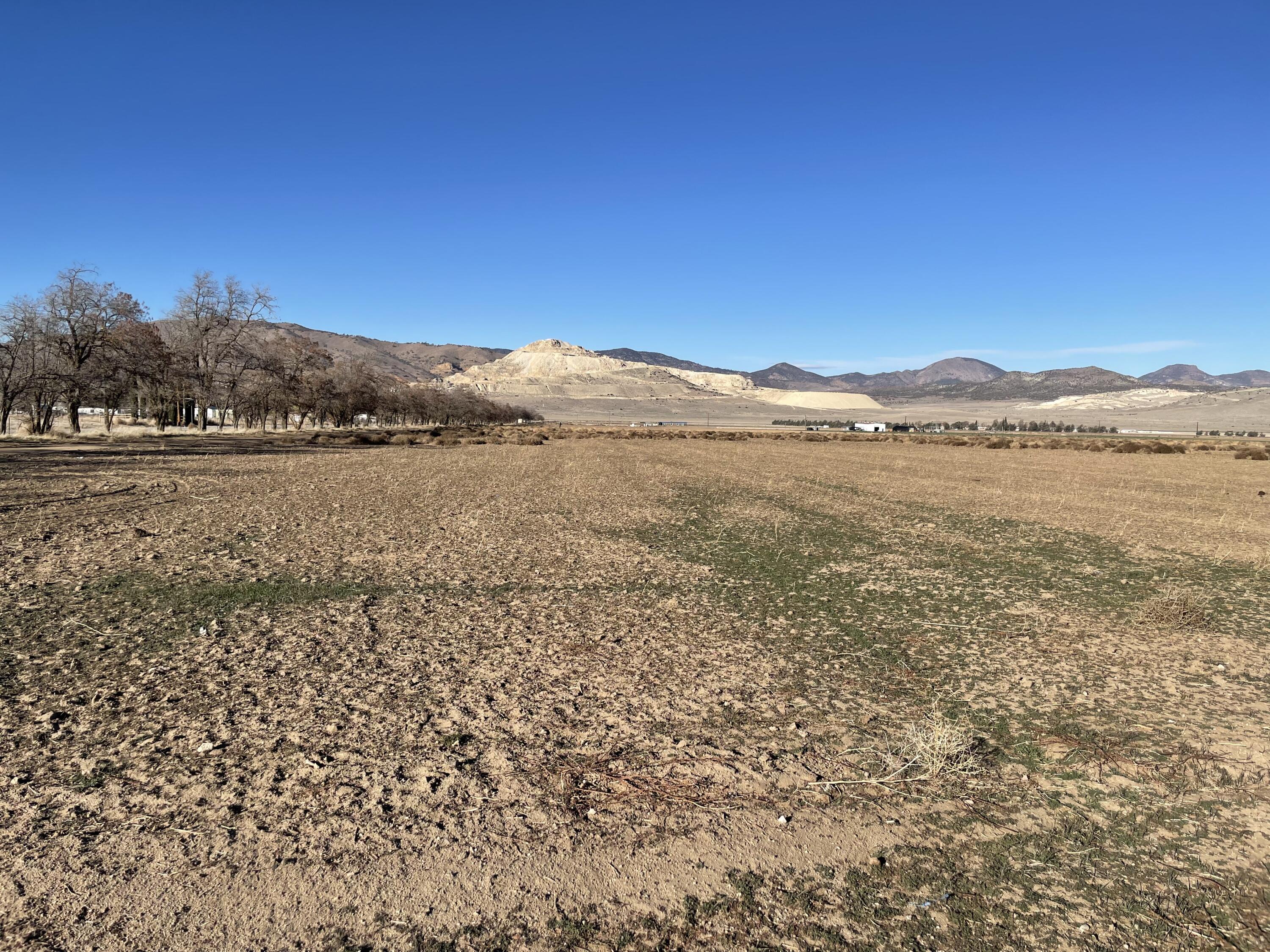 20028 Tehachapi Willow Springs Road Tehachapi, CA 93561 - Photo 1 of 24 a view of an lake with a mountain in the background