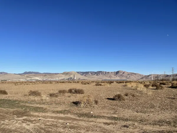 a view of an ocean and a mountain