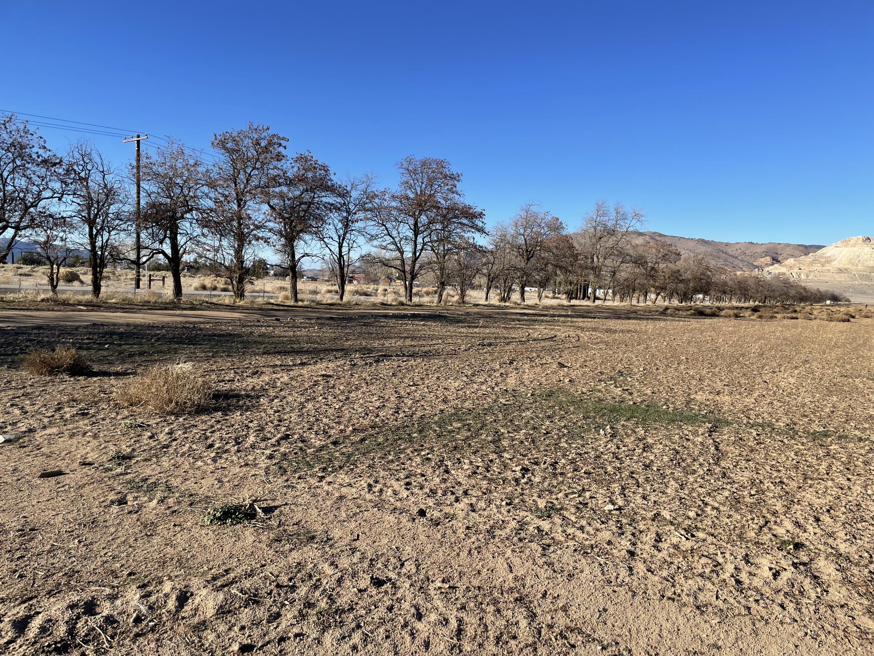 20028 Tehachapi Willow Springs Road Tehachapi, CA 93561 - Photo 2 of 24 a view of a lake with mountains in the background