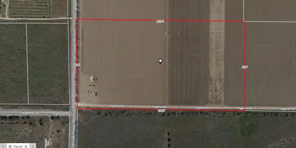 a bathroom with a shower and a wooden floor