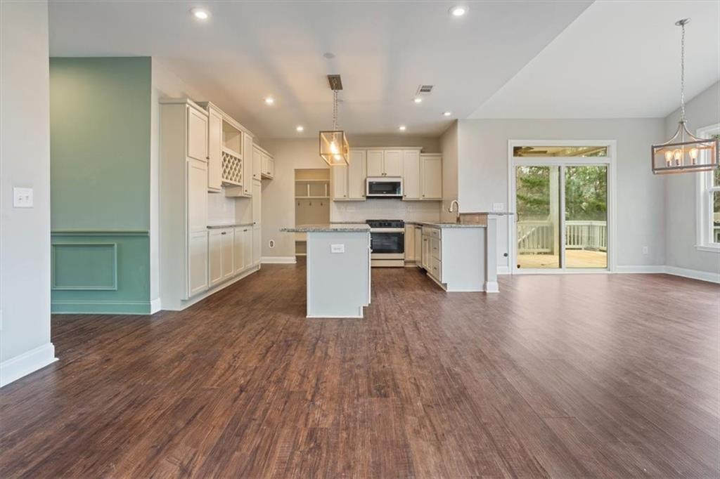 129 Rex Avenue Canton, GA 30114 - Photo 14 of 66 a view of kitchen with cabinets and wooden floor