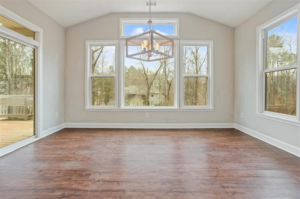 129 Rex Avenue Canton, GA 30114 - Photo 24 of 66 wooden floor chandelier and windows in a room