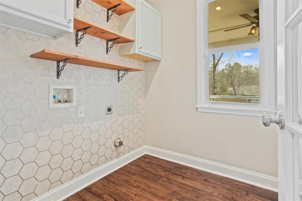 129 Rex Avenue Canton, GA 30114 - Photo 27 of 66 a view of a room with wooden floor and window