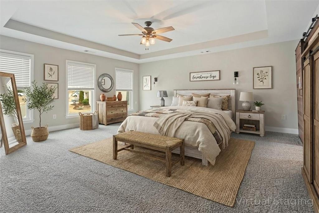 129 Rex Avenue Canton, GA 30114 - Photo 30 of 66 a bedroom with bed and a chandelier