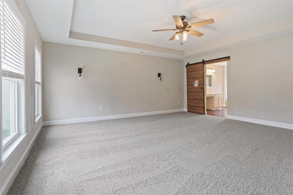 129 Rex Avenue Canton, GA 30114 - Photo 32 of 66 a view of a livingroom with a ceiling fan and window