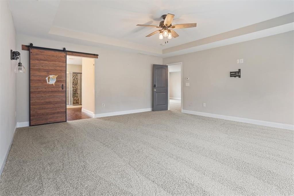 129 Rex Avenue Canton, GA 30114 - Photo 33 of 66 a view of an empty room with a ceiling fan