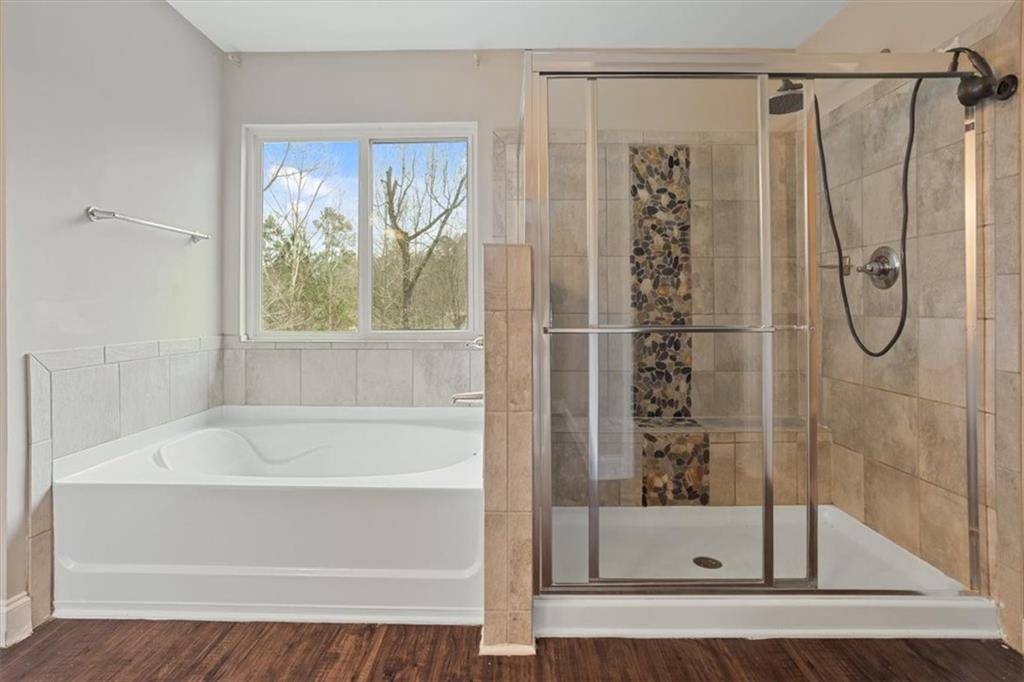 129 Rex Avenue Canton, GA 30114 - Photo 35 of 66 a bathroom with a shower and a bathtub