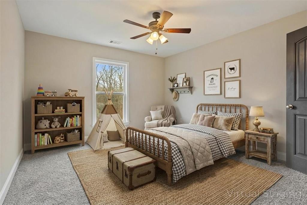 129 Rex Avenue Canton, GA 30114 - Photo 38 of 66 a bedroom with a bed a couch and a chandelier