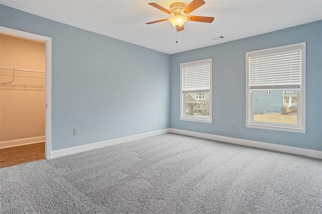 129 Rex Avenue Canton, GA 30114 - Photo 41 of 66 an empty room with windows and fan