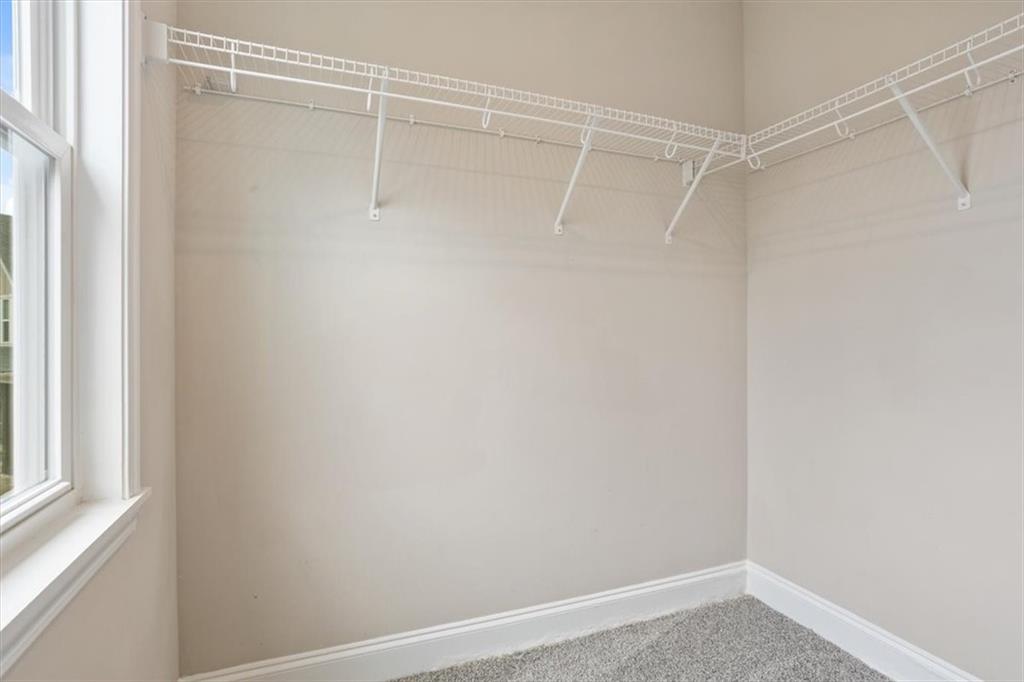 129 Rex Avenue Canton, GA 30114 - Photo 43 of 66 a view of a room with racks on the wall