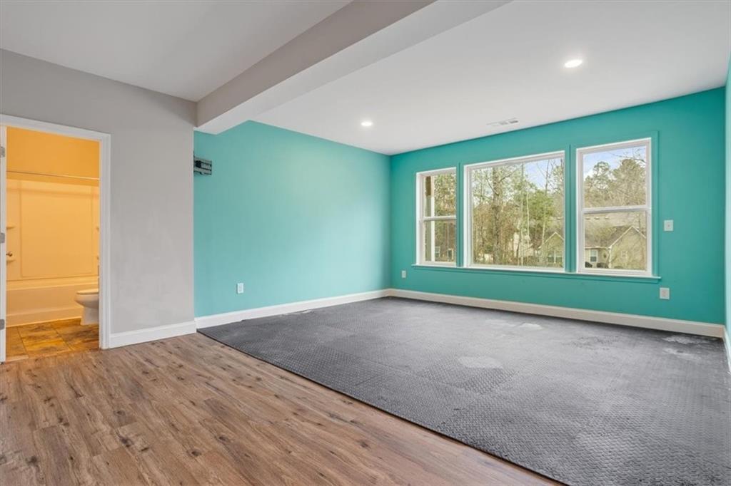 129 Rex Avenue Canton, GA 30114 - Photo 48 of 66 an empty room with wooden floor and windows