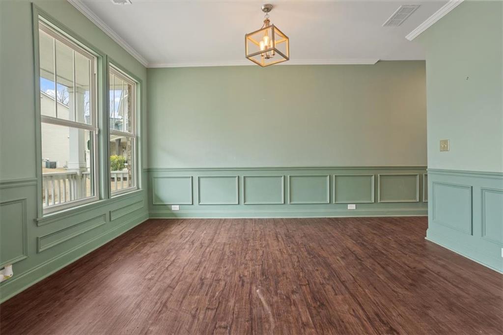 129 Rex Avenue Canton, GA 30114 - Photo 5 of 66 a view of a room with wooden floor and windows