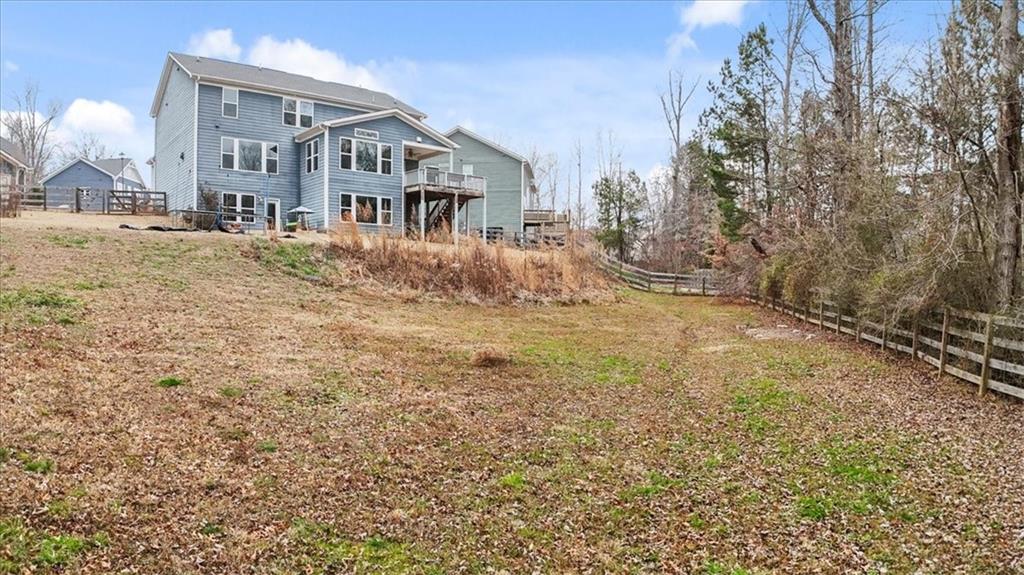 129 Rex Avenue Canton, GA 30114 - Photo 56 of 66 a front view of a house with a yard