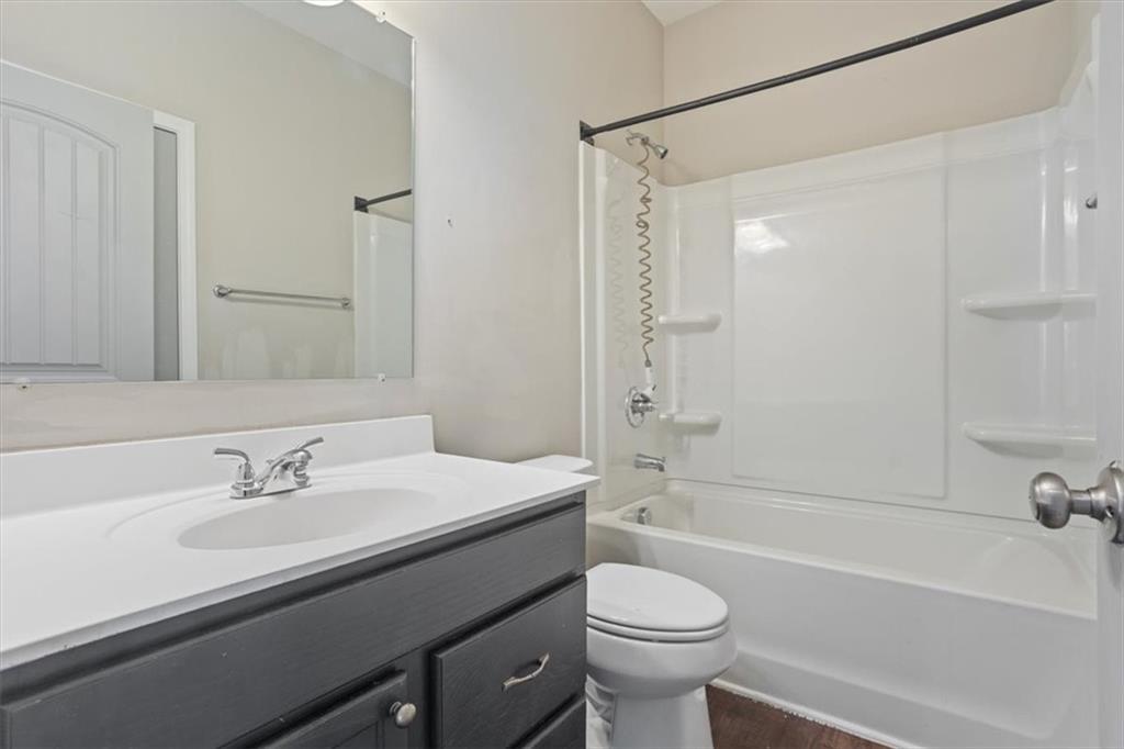 129 Rex Avenue Canton, GA 30114 - Photo 8 of 66 a bathroom with a sink a toilet and a bathtub