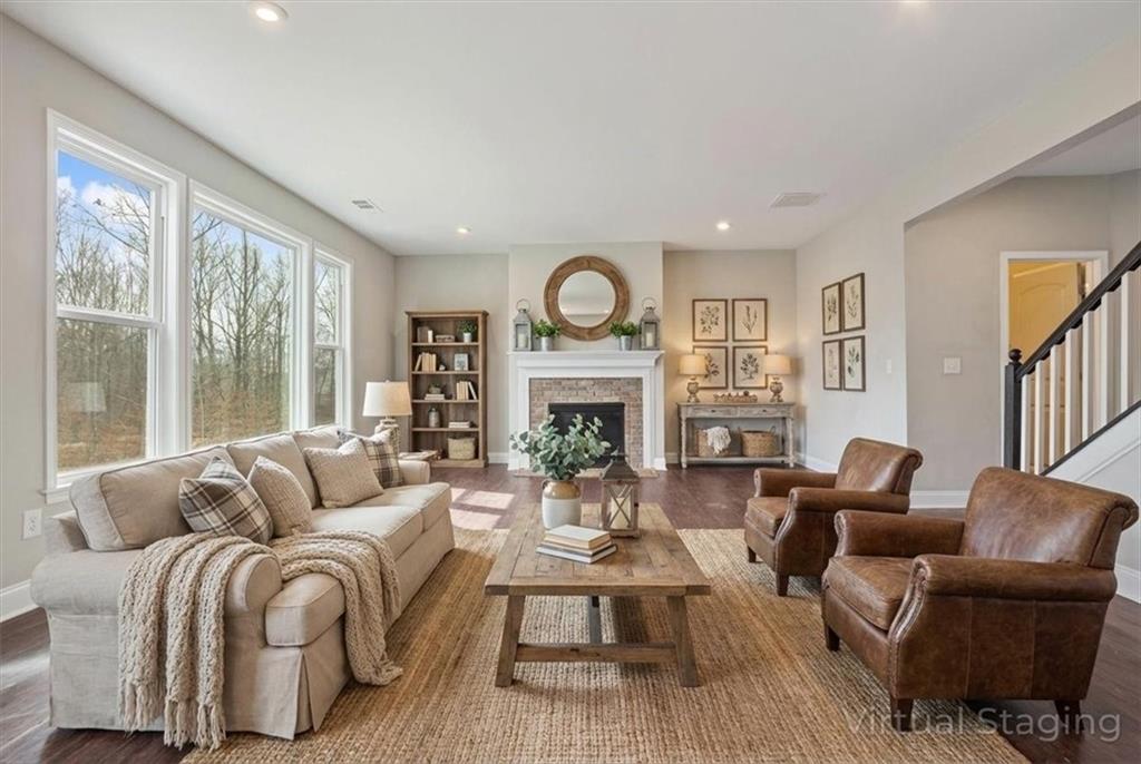 129 Rex Avenue Canton, GA 30114 - Photo 10 of 66 a living room with fireplace furniture and a large window