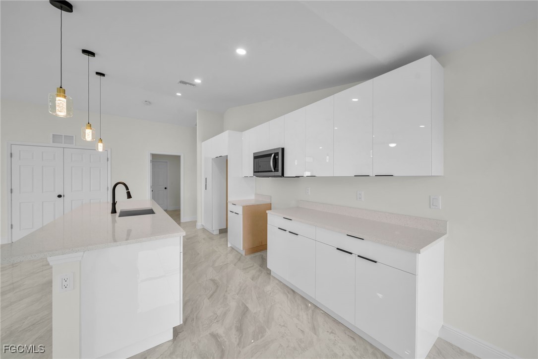 4106 35th Street Southwest Lehigh Acres, FL 33976 - Photo 14 of 38 a living room with furniture and a flat screen tv