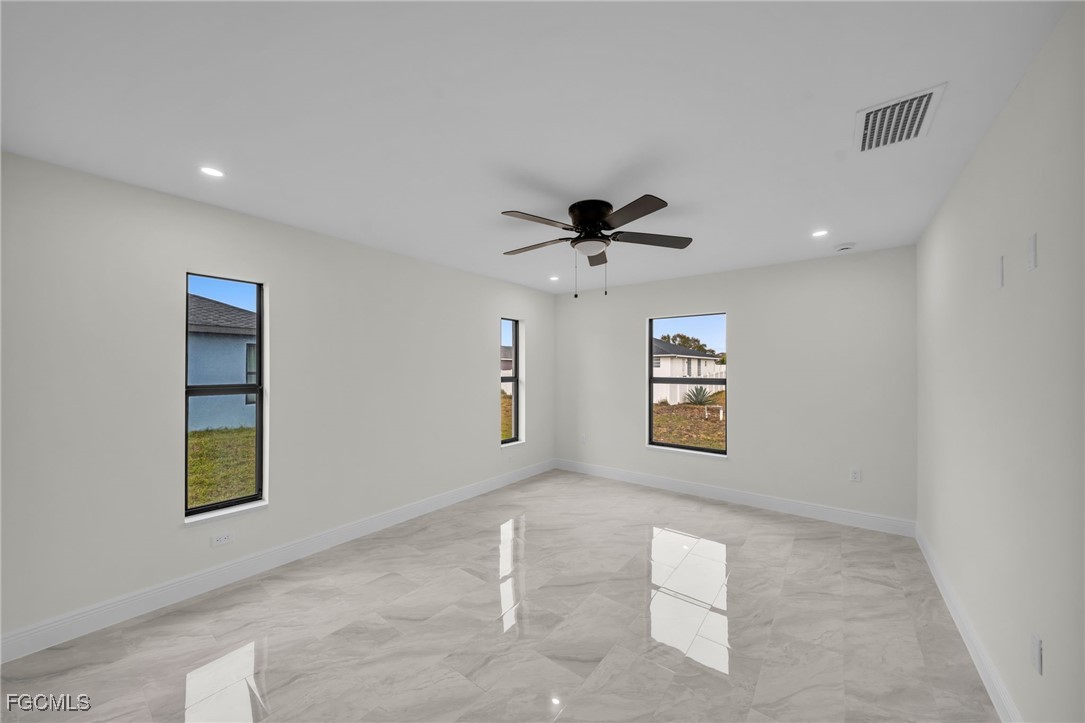 4106 35th Street Southwest Lehigh Acres, FL 33976 - Photo 19 of 38 a view of an empty room with a window