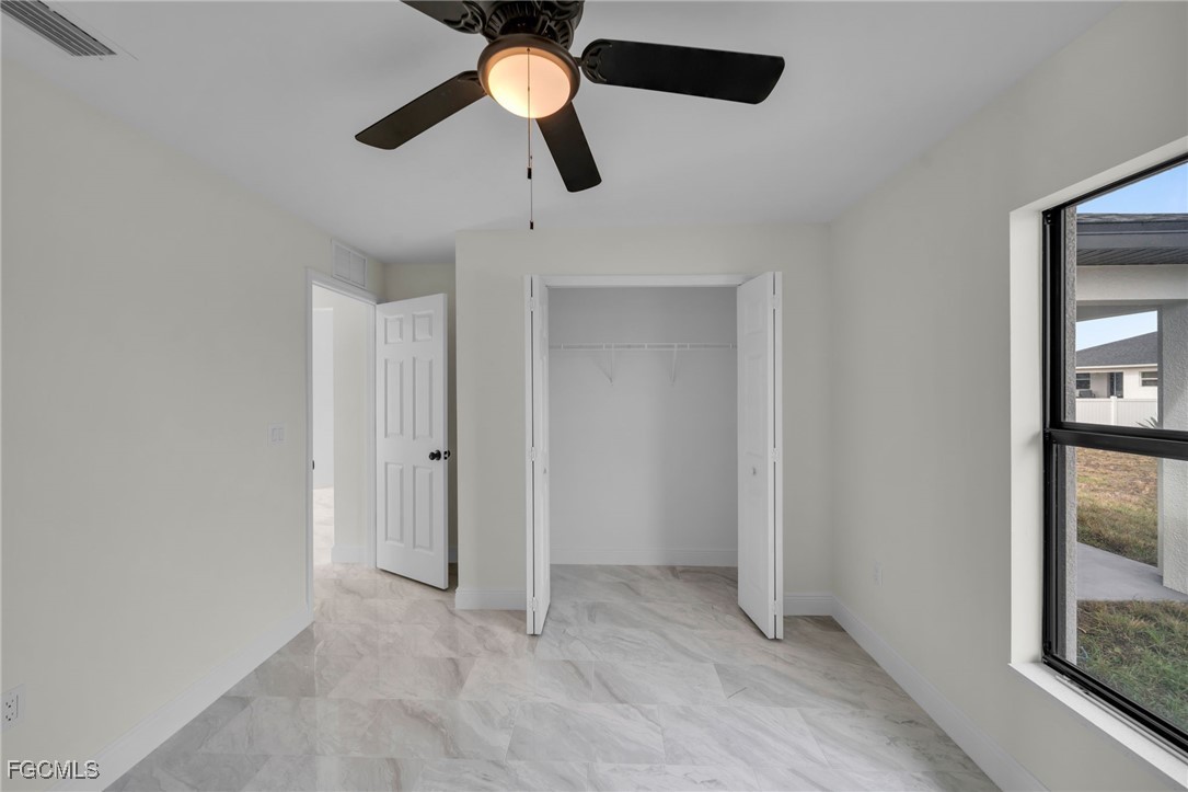 4106 35th Street Southwest Lehigh Acres, FL 33976 - Photo 29 of 38 en view of an empty room and window