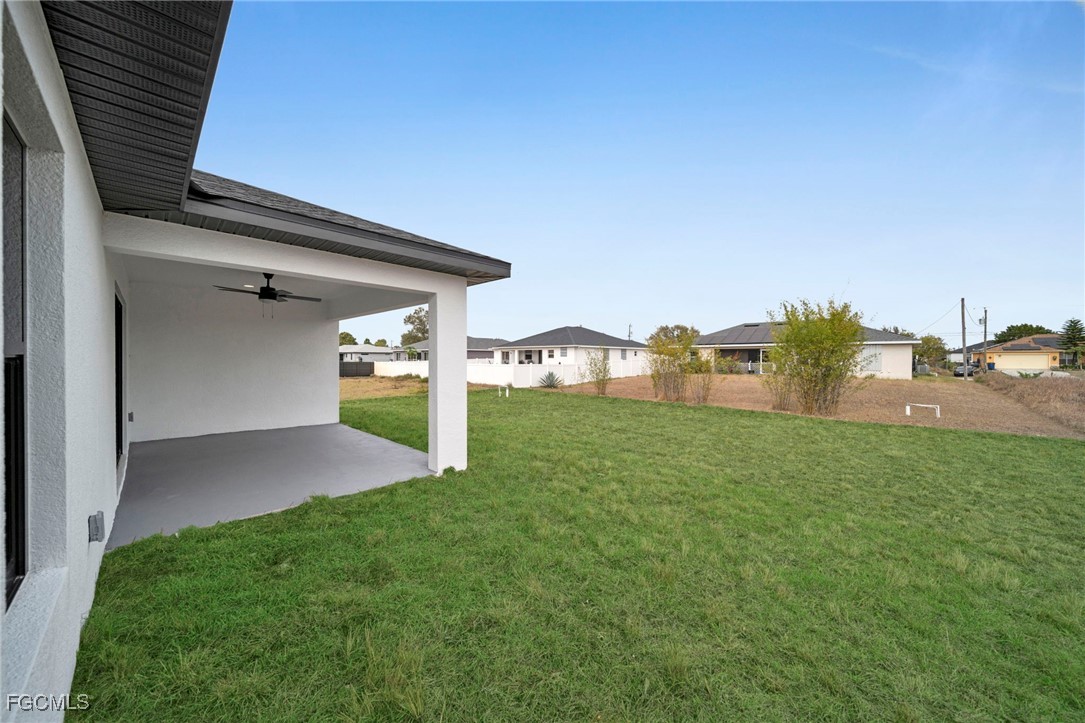 4106 35th Street Southwest Lehigh Acres, FL 33976 - Photo 31 of 38 a view of a back yard