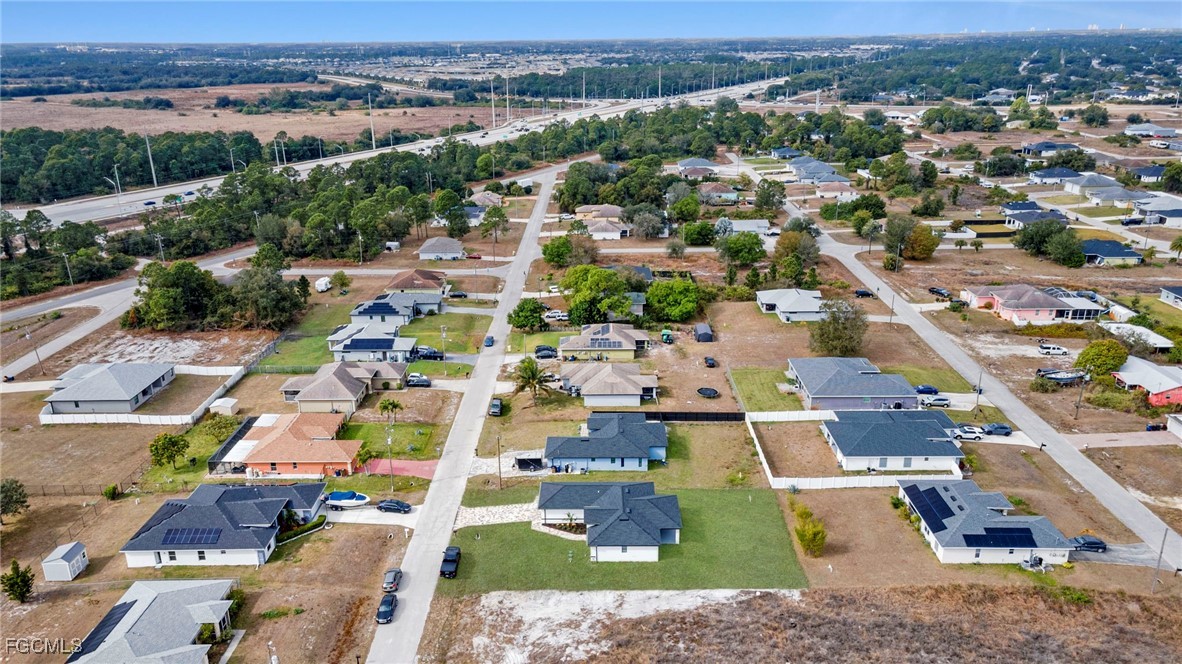 4106 35th Street Southwest Lehigh Acres, FL 33976 - Photo 36 of 38 an aerial view of residential houses with outdoor space