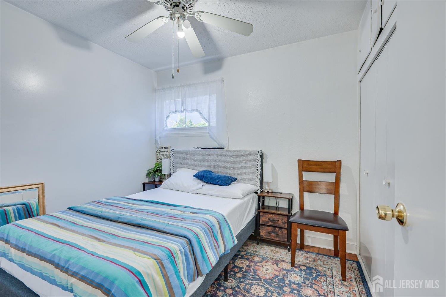 15 Markham Road Edison, NJ 08817 - Photo 24 of 32 a bedroom with a bed and a chandelier