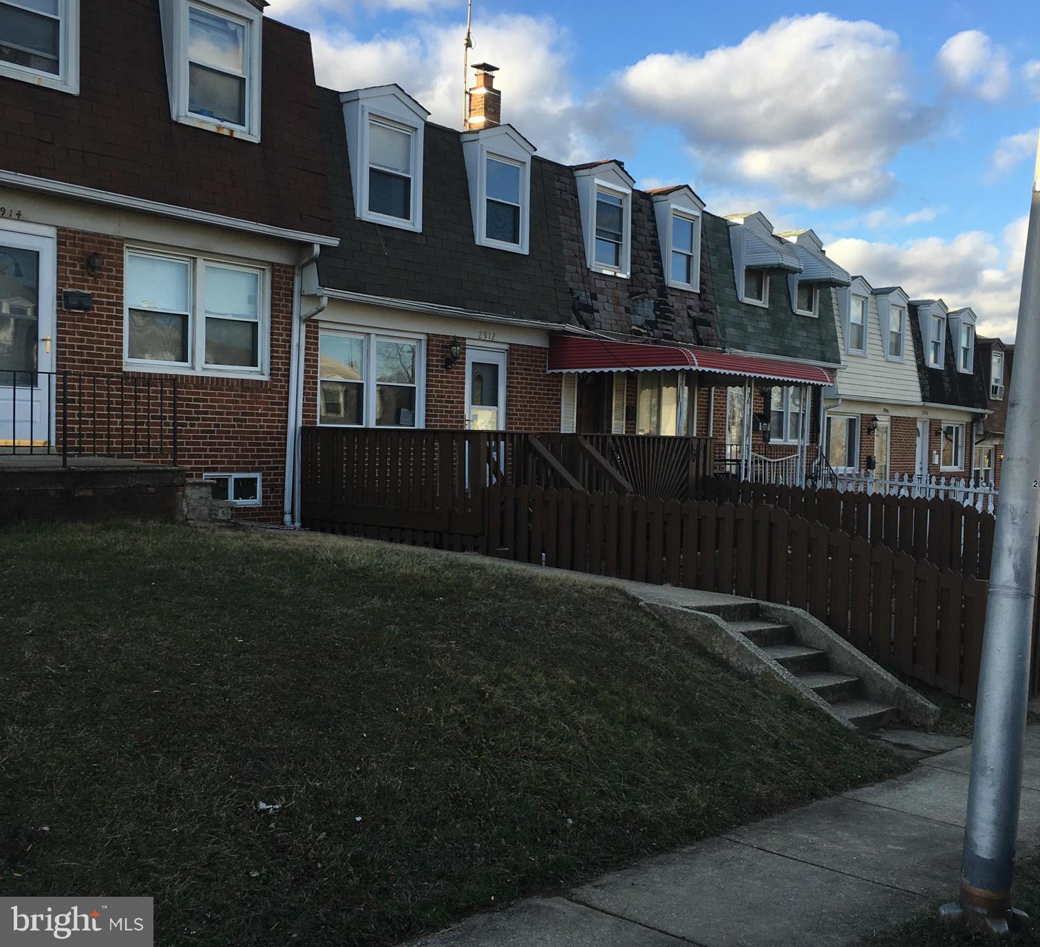 2912 Rayshire Road Baltimore, MD 21230 - Photo 1 of 1 a front view of a house with a yard