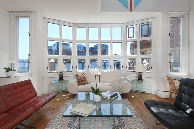 a living room with furniture or couch and a bookshelf