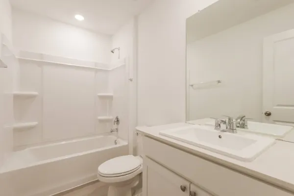a bathroom with a sink a toilet and a bathtub