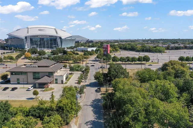 an aerial view of a house with a swimming pool